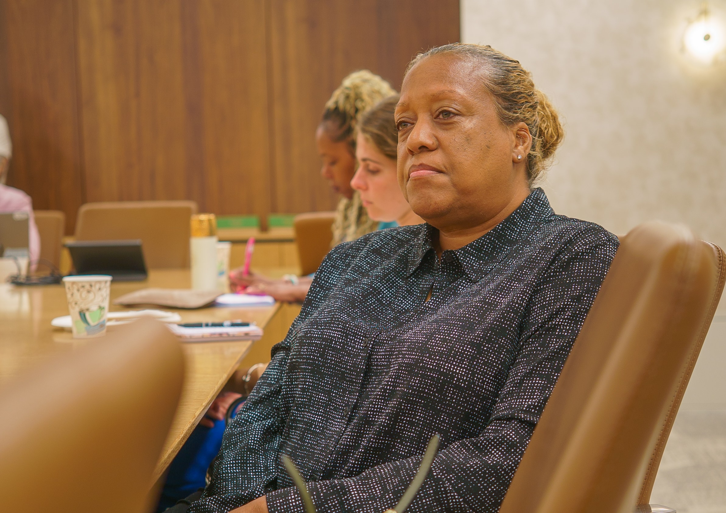 Attendee listening at Friday Morning Fundraising