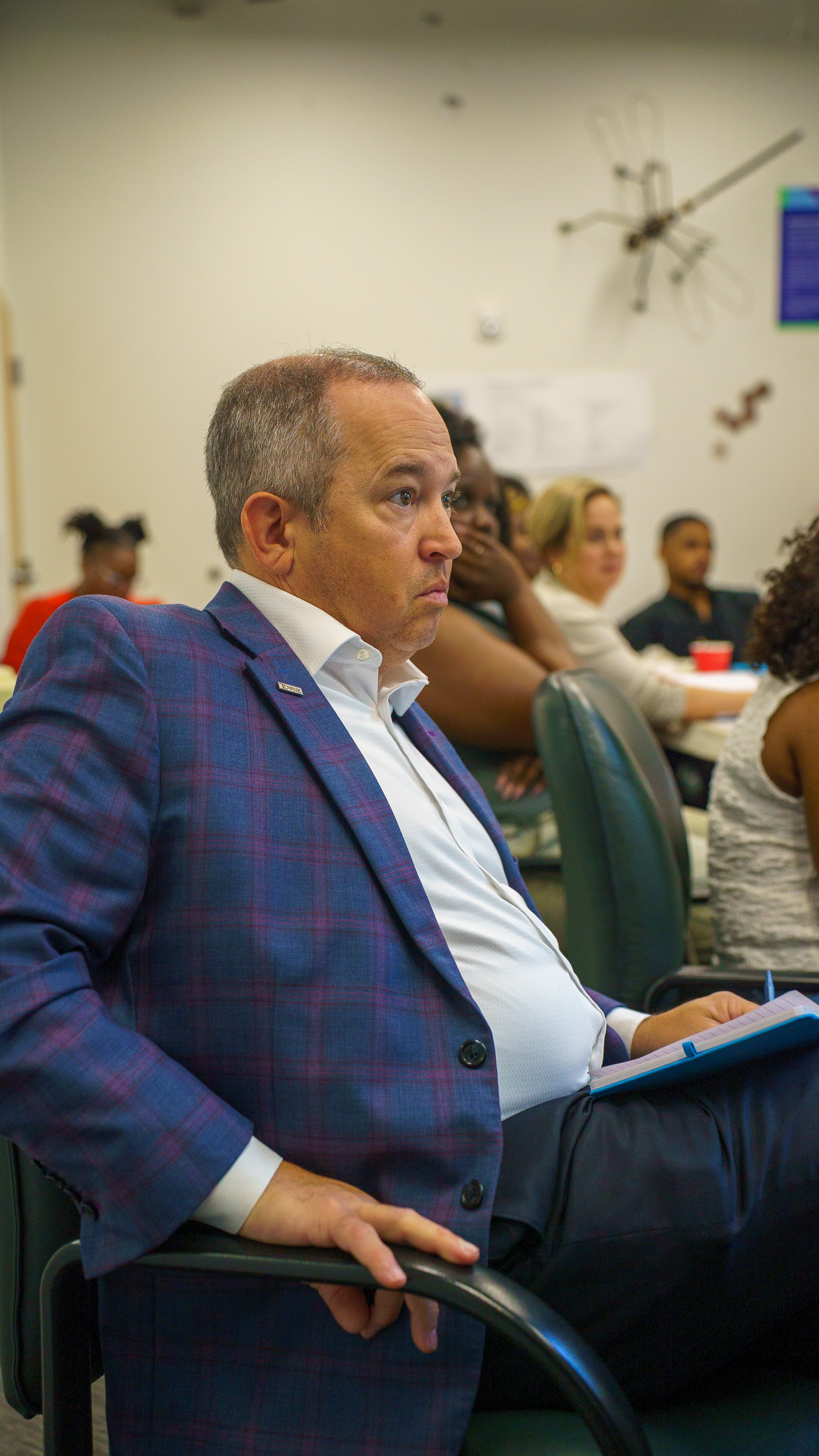 Attendee reading a card at Friday Morning Fundraising
